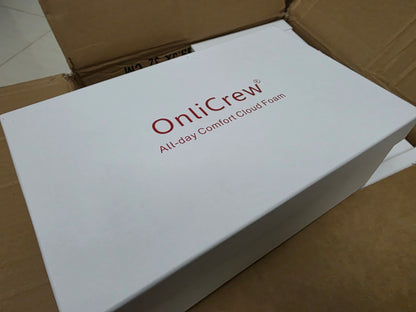 White box with 'ontiCrew' branding on a cardboard surface + flydubai flat shoes